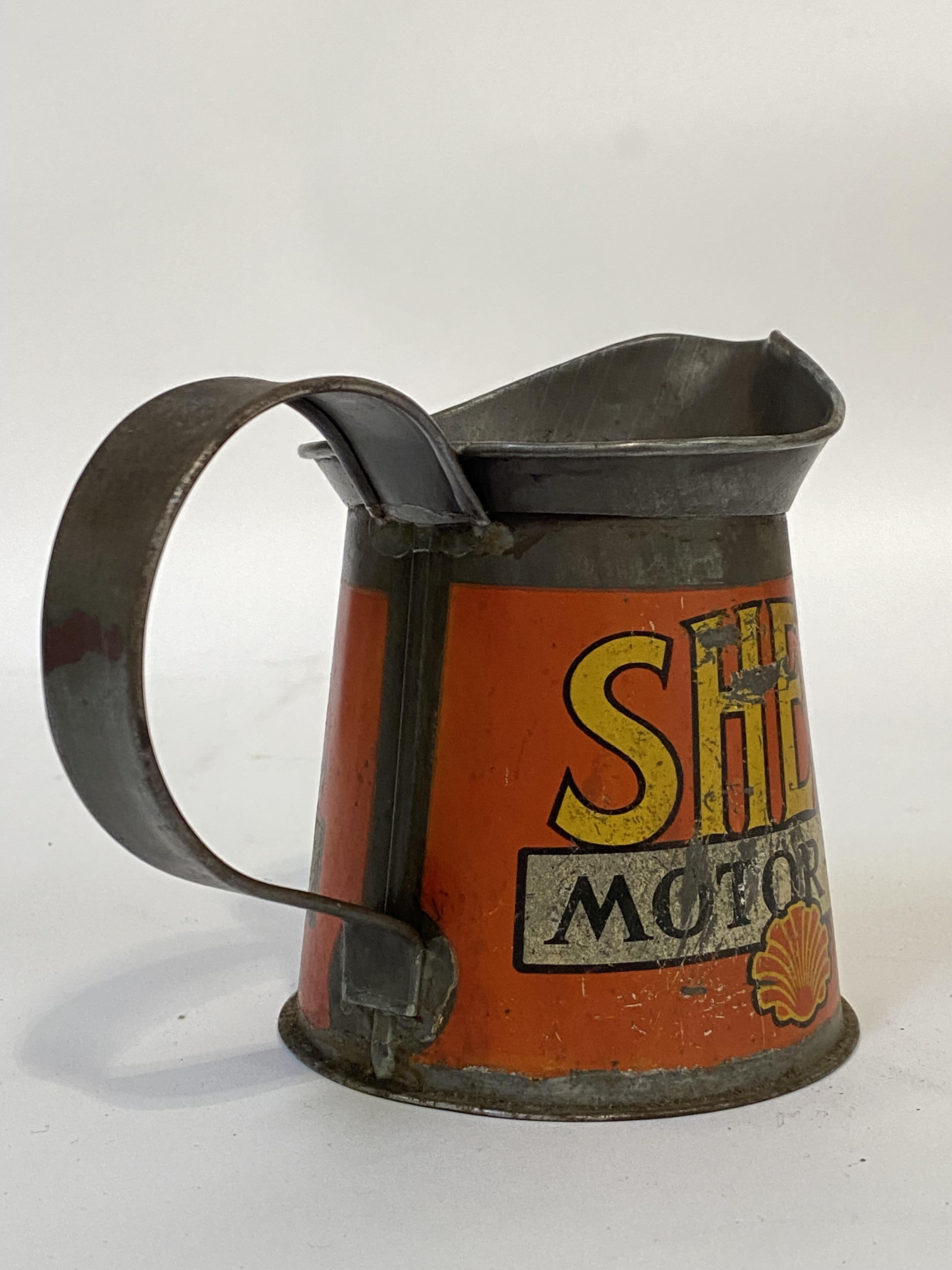 An early 20th century Shell Motor Oil 1 pint jug, painted all round. H13cm. - Image 2 of 2