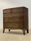 A Regency mahogany bow front chest, fitted with two short and three long drawers, raised on