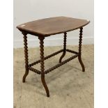 A Victorian mahogany occasional table, the shaped top raised on bobbin turned and splayed supports