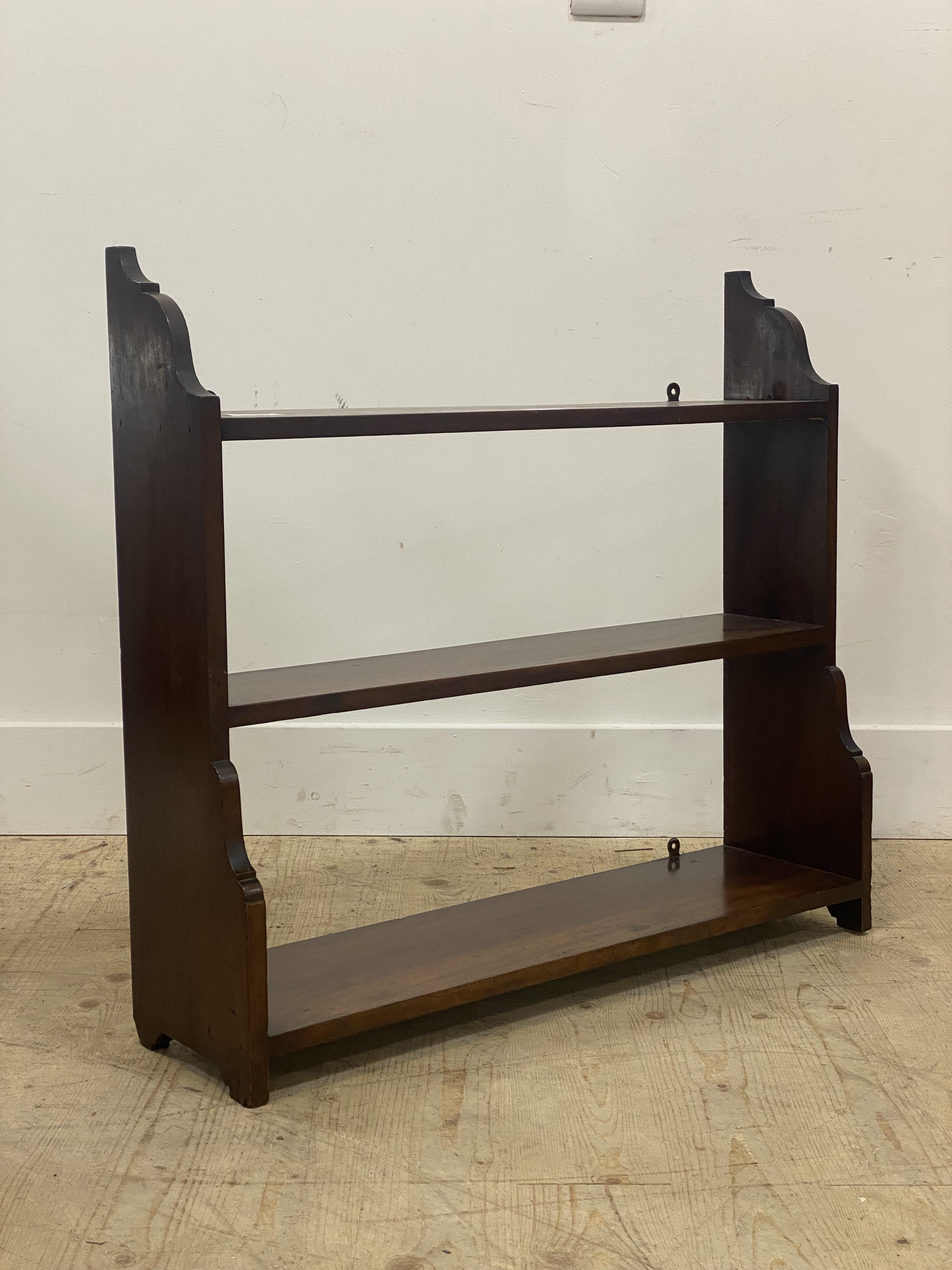 A late 19th century mahogany three tier waterfall wall shelf. H70cm, W77cm, D22cm.