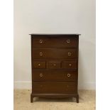 A vintage stag mahogany chest chest of four long and three short drawers raised on bracket supports.