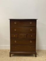 A vintage stag mahogany chest chest of four long and three short drawers raised on bracket supports.