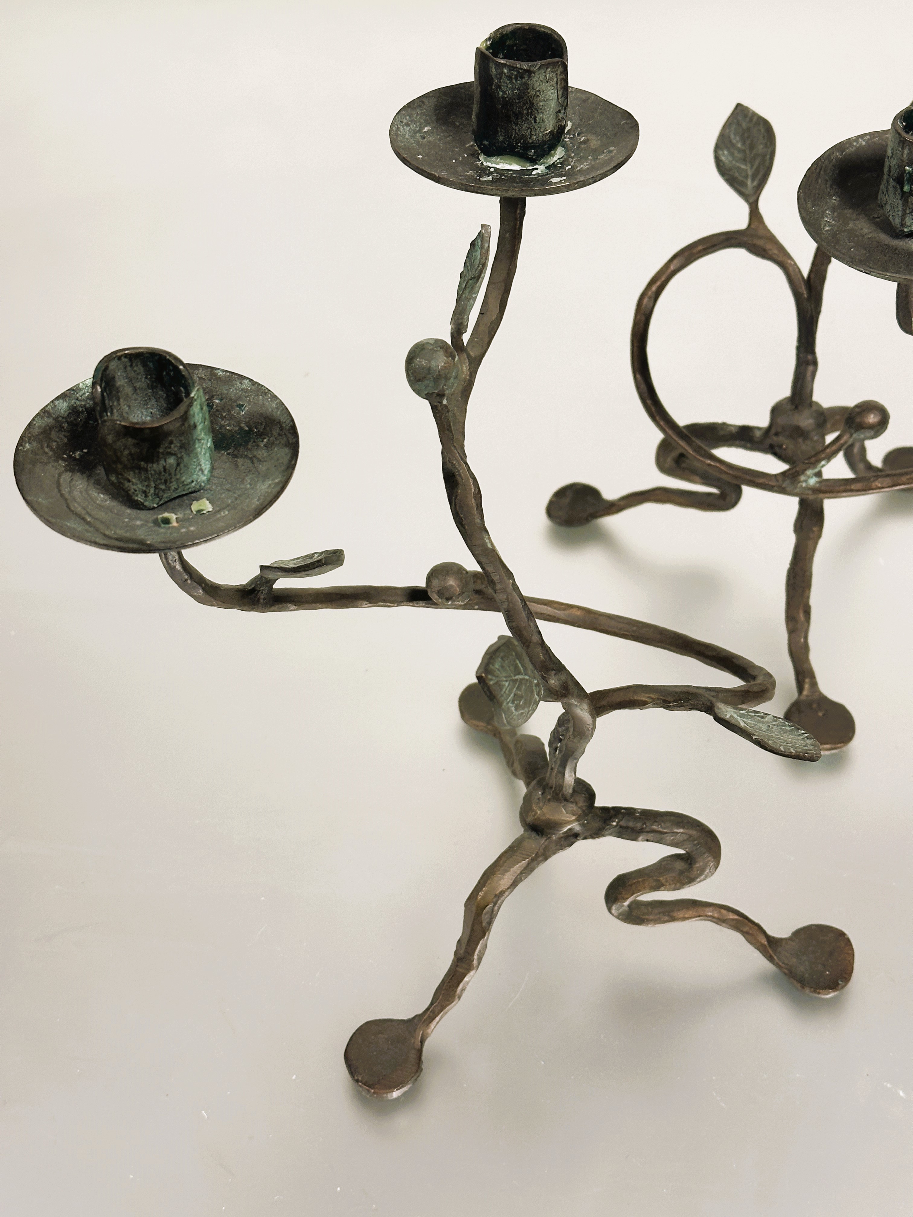 A pair of cast bronze scrolling stem floral two branch candelabra raised on tripartite base with pad - Image 2 of 2