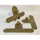 A set of three mid to late 19th century brass door knobs with integrated finger plates. L42cm.