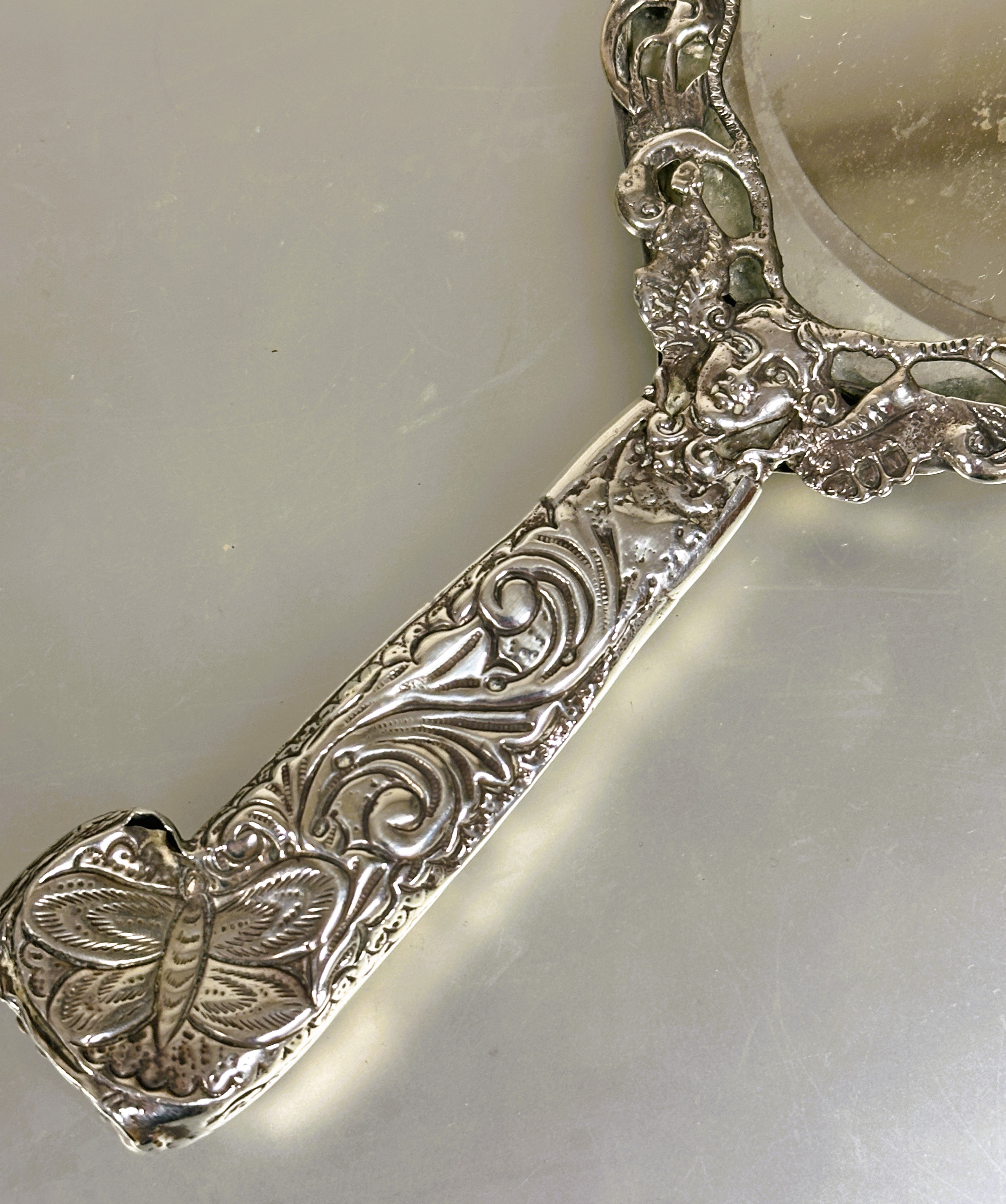 A Victorian London silver hand mirror with cast engraved scrolling border decorated with birds, - Image 3 of 4