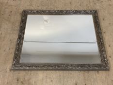 A traditional silvered composition wall mirror with bevelled glass. 110cm x 136cm.