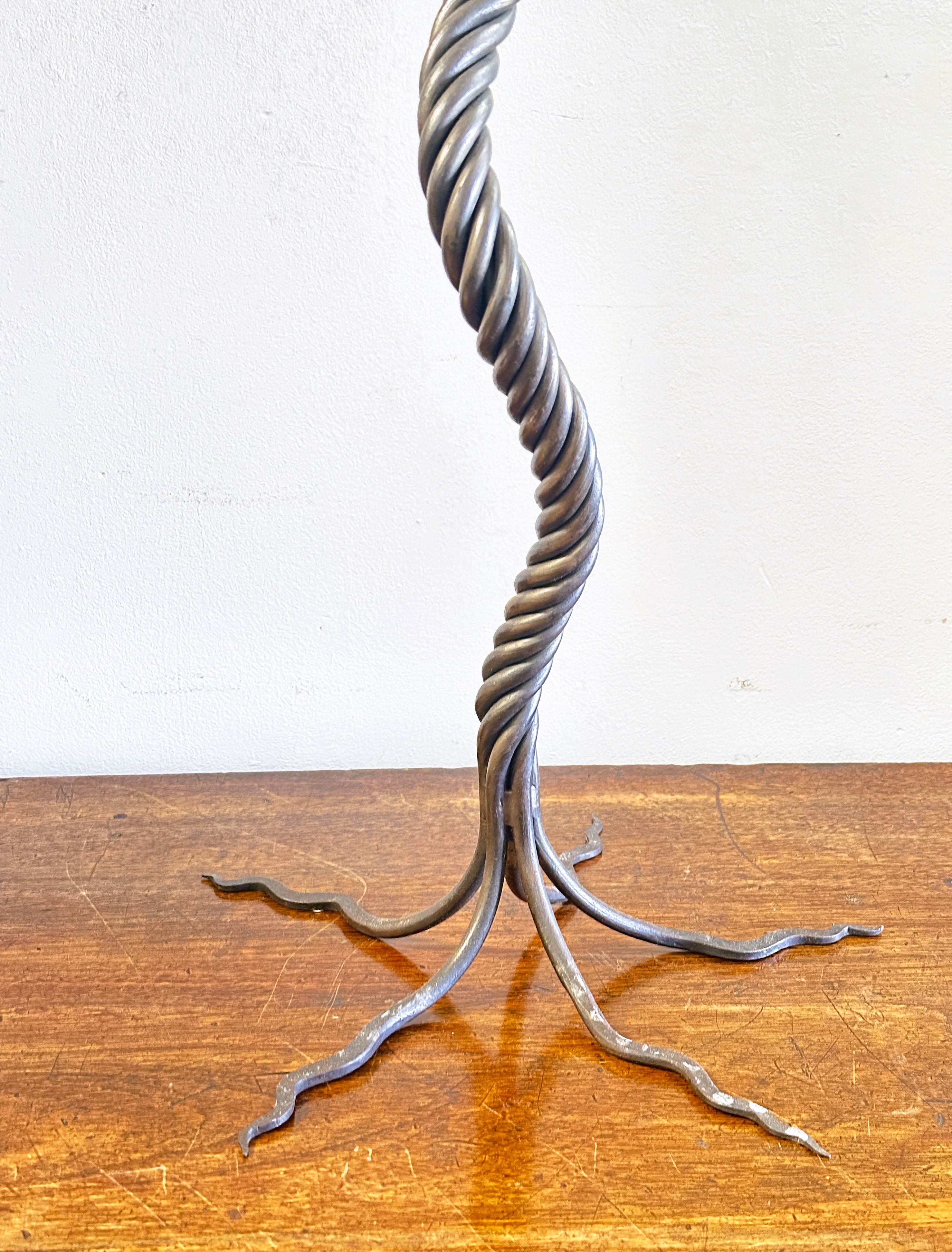 A modern wrought iron scrolling six branch candle stand of tree like design raised on five scrolling - Image 2 of 3