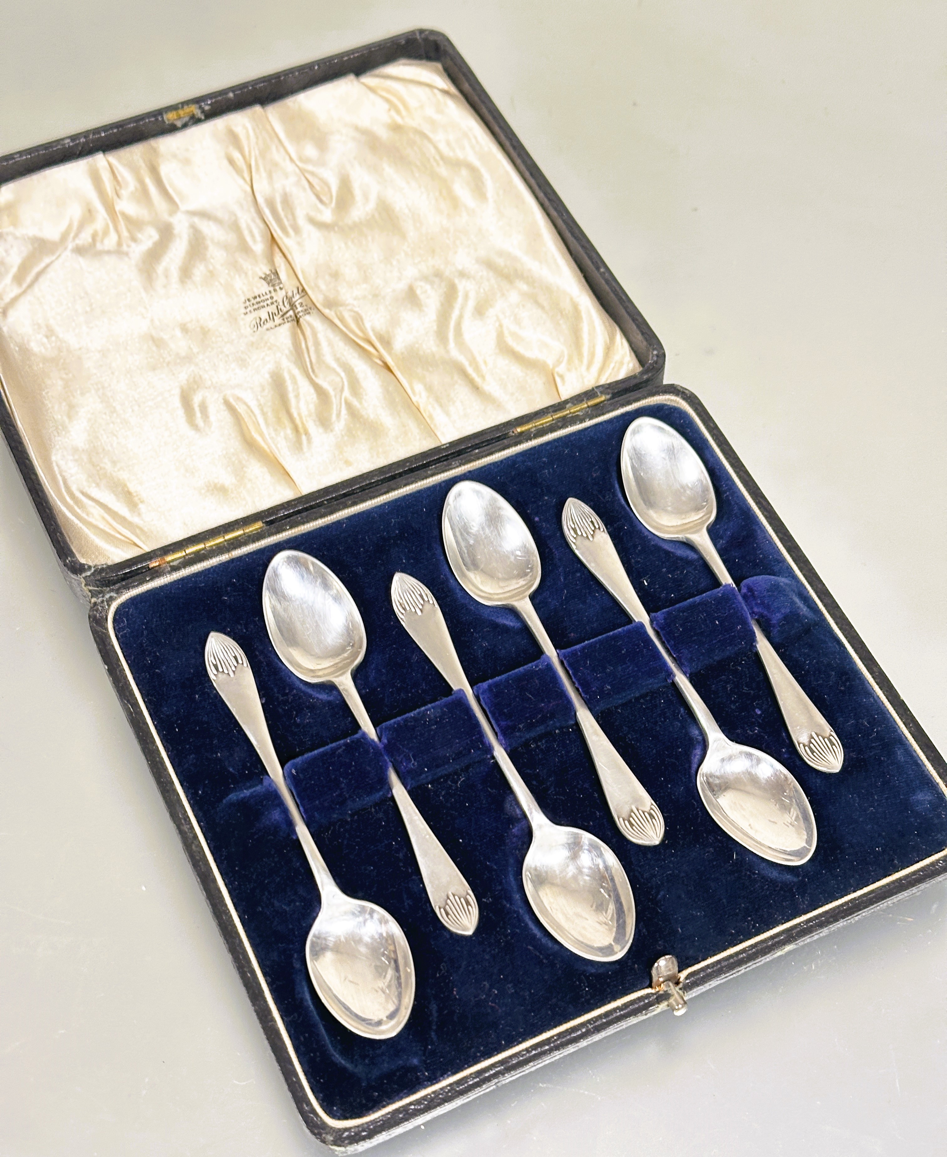 A Edwardian set of six Sheffield silver tea spoons with original fitted case retailed by Ralph C