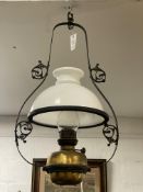A Victorian wrought iron hanging kitchen oil / parafin lamp, with opeline glass domed shade. H70cm