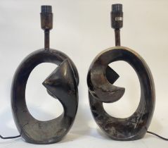 A pair of contemporary bronzed metal table lamps in the modernist style. H48cm.