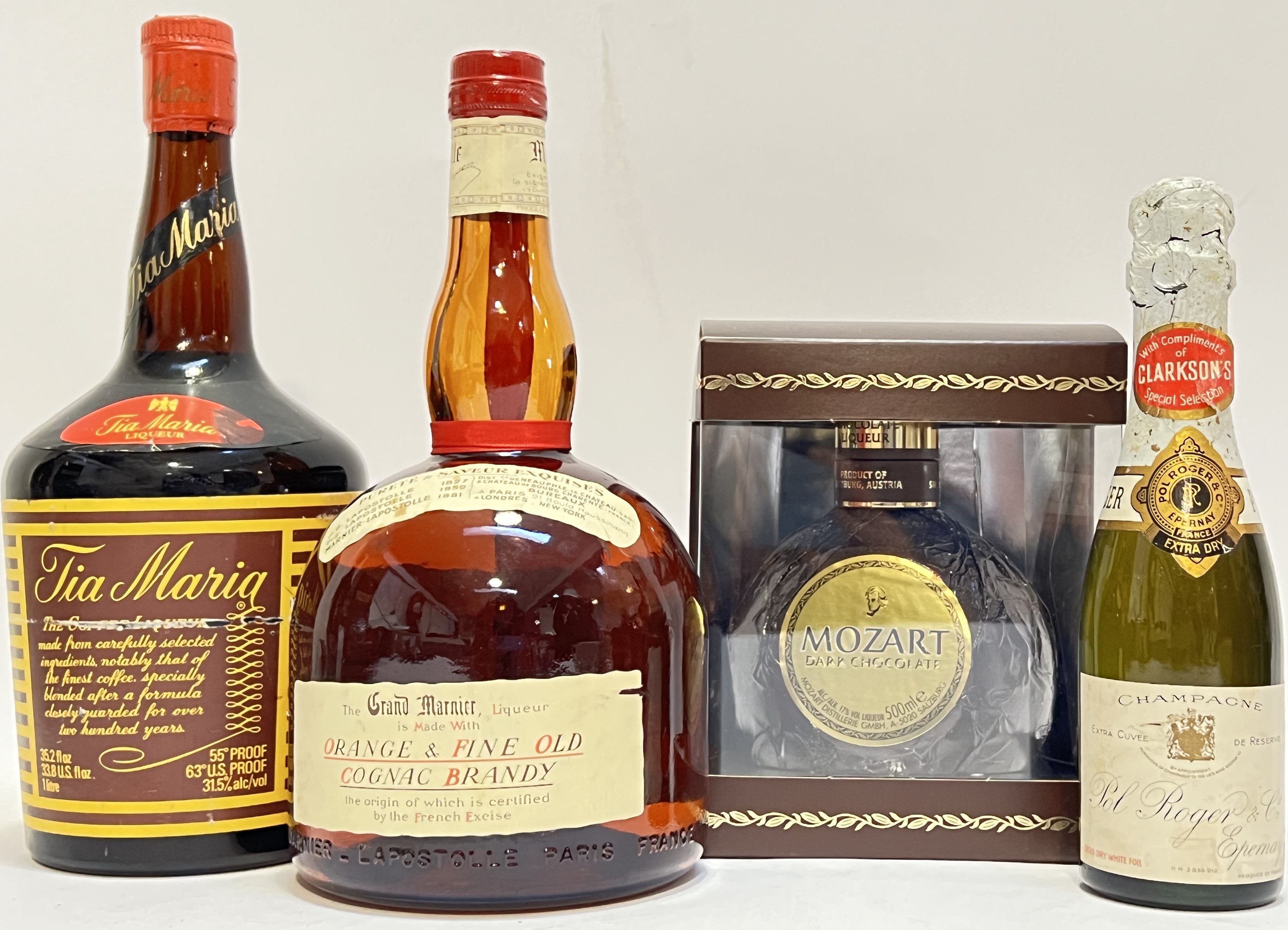 A mixed group of liquor comprising a 1 litre bottle of Tia Maria Liqueur, a Grand Marnier Orange and