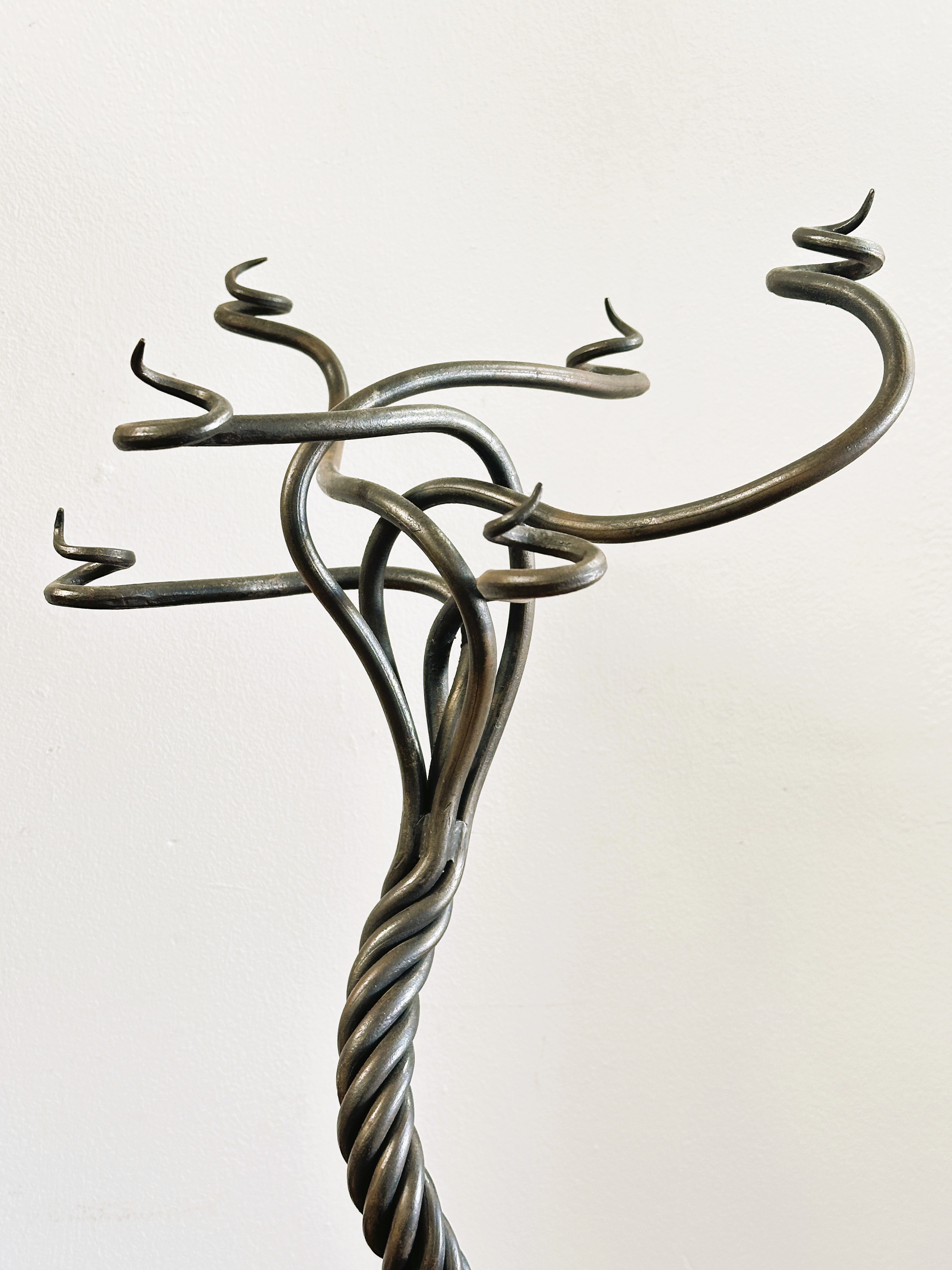 A modern wrought iron scrolling six branch candle stand of tree like design raised on five scrolling - Image 3 of 3