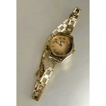 A ladys gilt metal Seiko quartz wrist watch on 9ct gold chain link bracelet a/f