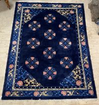 A Chinese super washed wool carpet, the blue ground decorated with repeating medallions and having a