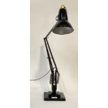 Herbert Terry and Sons, a mid century anglepoise lamp, finished in black paint, on a stepped