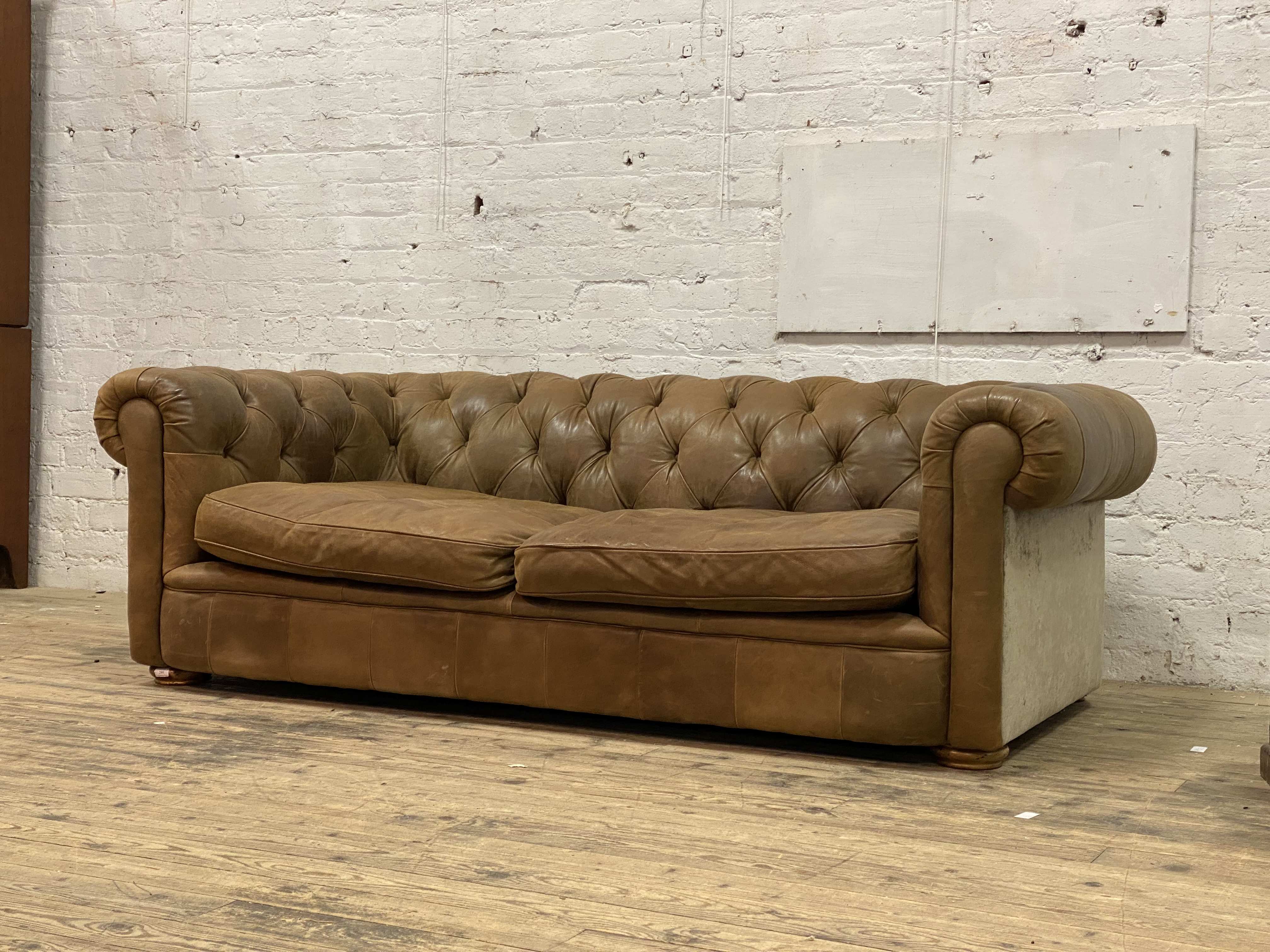 A traditional chesterfield sofa, upholstered in deep buttoned tan leather and crushed velvet sides - Image 2 of 3