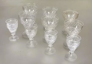 A part set of crystal slice cut tapered glasses to include a pair of red wine glasses, H x 11.5cm,