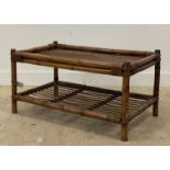 A 1960s bamboo and rattan rectangular coffee table with under tier. H52cm, W102cm, D59cm
