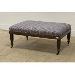 A large Victorian style walnut footstool / coffee table, the upholstered top raised on turned