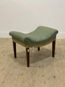 An early 20th century stool, the dished top upholstered in green damask, raised on square tapered