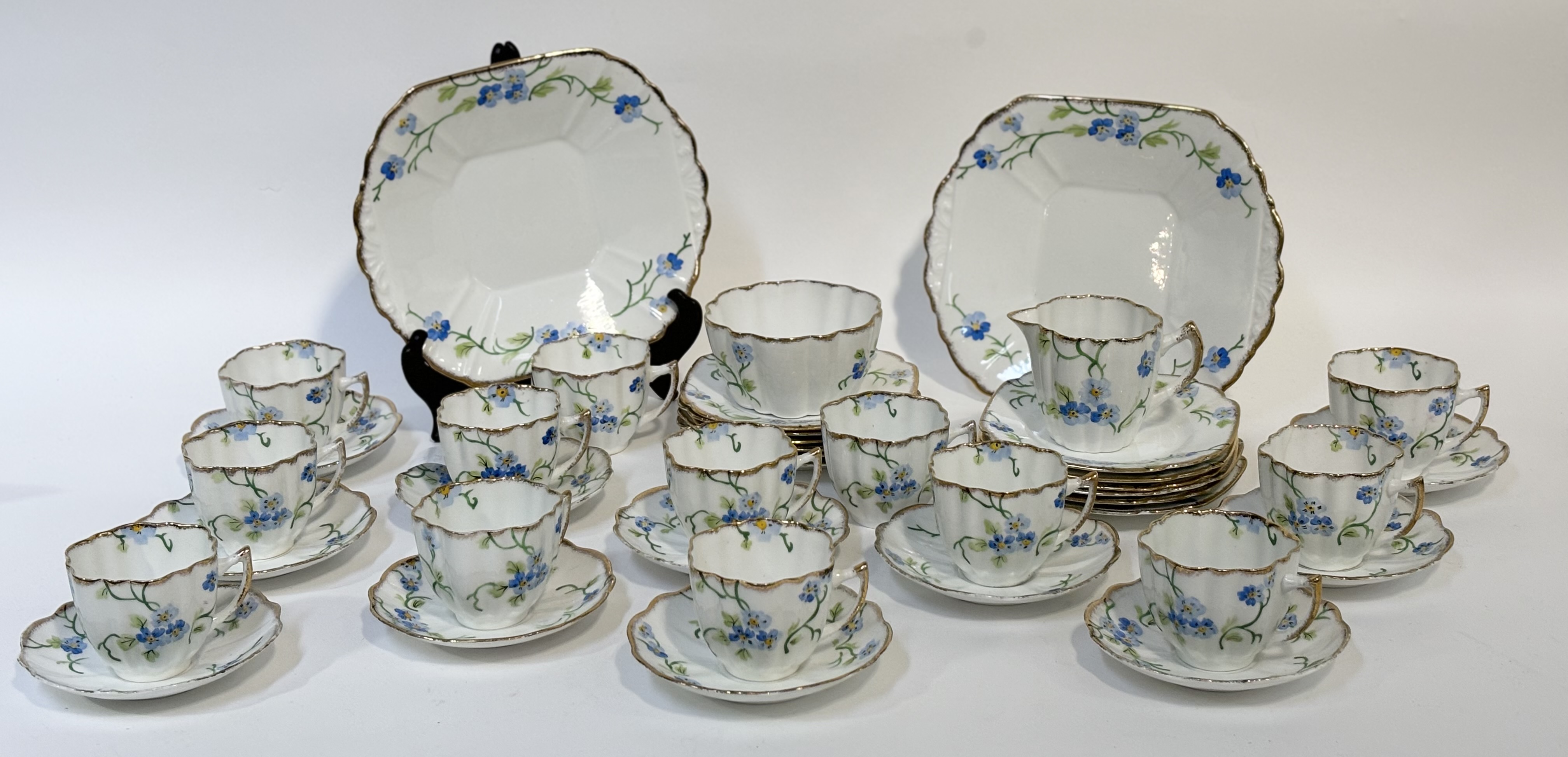 A Melba bone China part tea service  decoration with Forget-me-not's with gilt edging, comprising, a