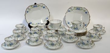 A Melba bone China part tea service  decoration with Forget-me-not's with gilt edging, comprising, a