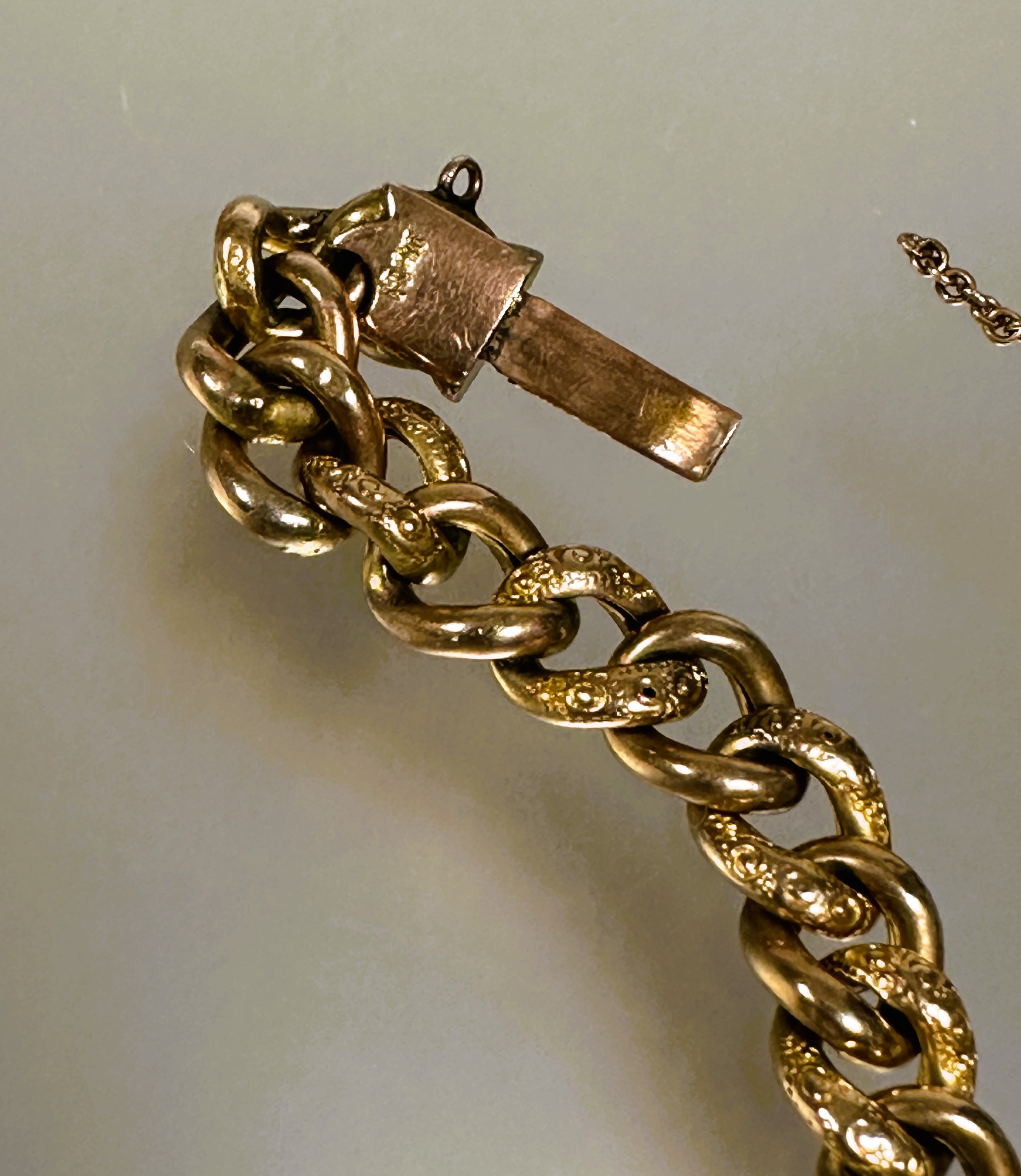 A late 19thc 9ct gold engraved kerb link chain bracelet with clasp fastening and safety chain - Image 5 of 5
