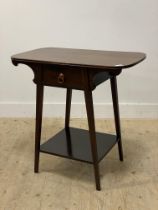 An Arts and Crafts period mahogany side table, the shaped top above a drawer and raised on square
