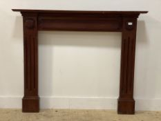 A traditional stained mahogany fire surround. H114cm x 140cm aperture 92cm x 92cm.