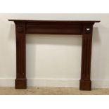 A traditional stained mahogany fire surround. H114cm x 140cm aperture 92cm x 92cm.