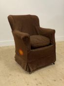 A late 19th century upholstered armchair, raised on square tapered supports moving on castors.