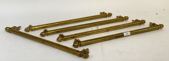 A set of five late 19th century brass sash window handles. L55cm.