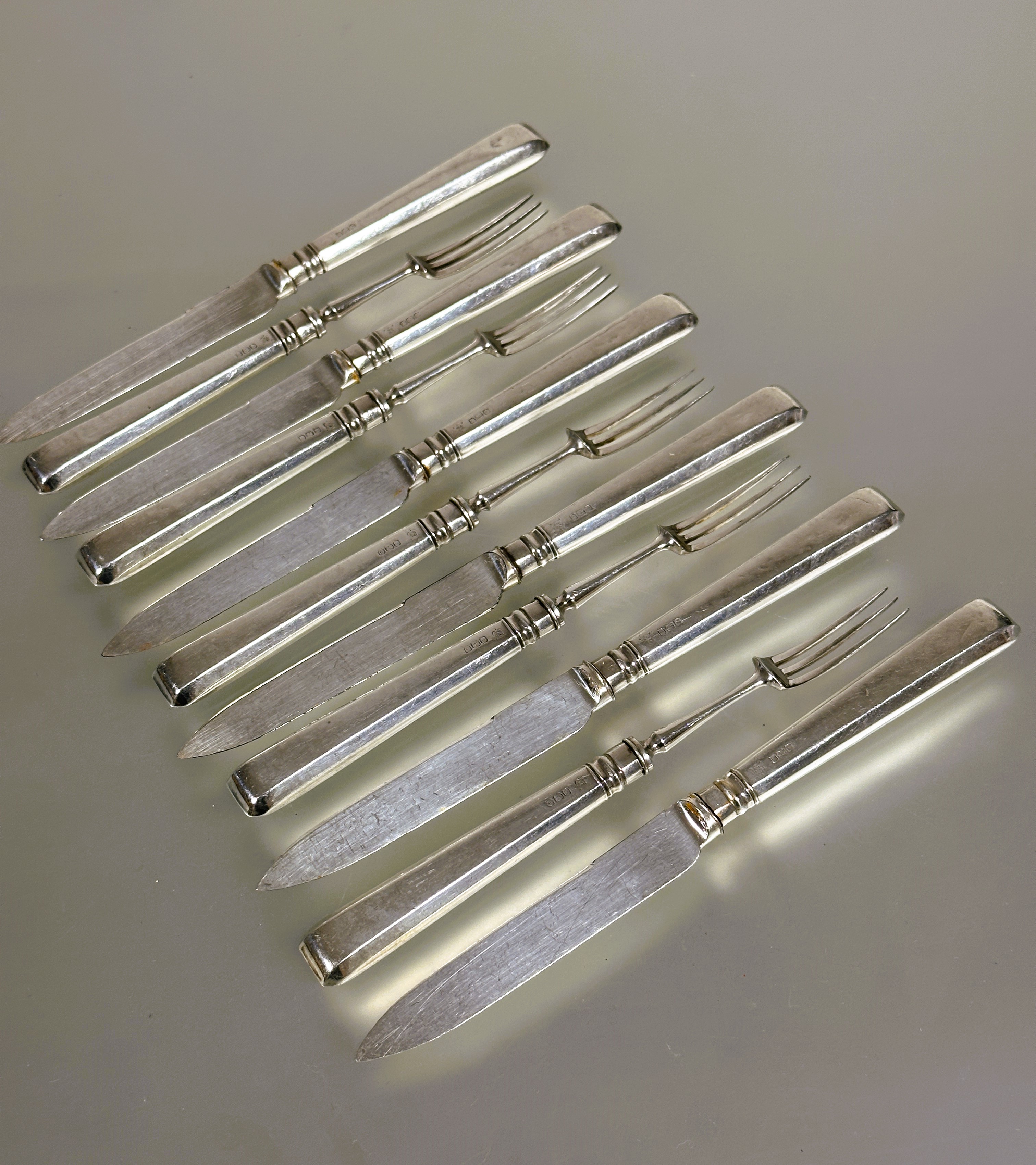 A Set of six Sheffield silver handled fruit knives and five forks L x 17cm (11)