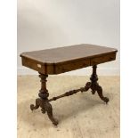 A Victorian walnut library writing table, the top inset with brown skiver writing surface, above two