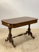 A Victorian walnut library writing table, the top inset with brown skiver writing surface, above two
