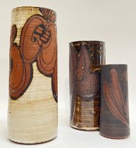 Three studio pottery earthenware cylindrical vases with paper/wax-resist decoration (two marked