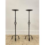 A pair of floor standing wrought iron prickit style candle sticks, H83cm.
