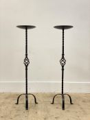 A pair of floor standing wrought iron prickit style candle sticks, H83cm.