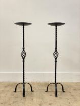 A pair of floor standing wrought iron prickit style candle sticks, H83cm.