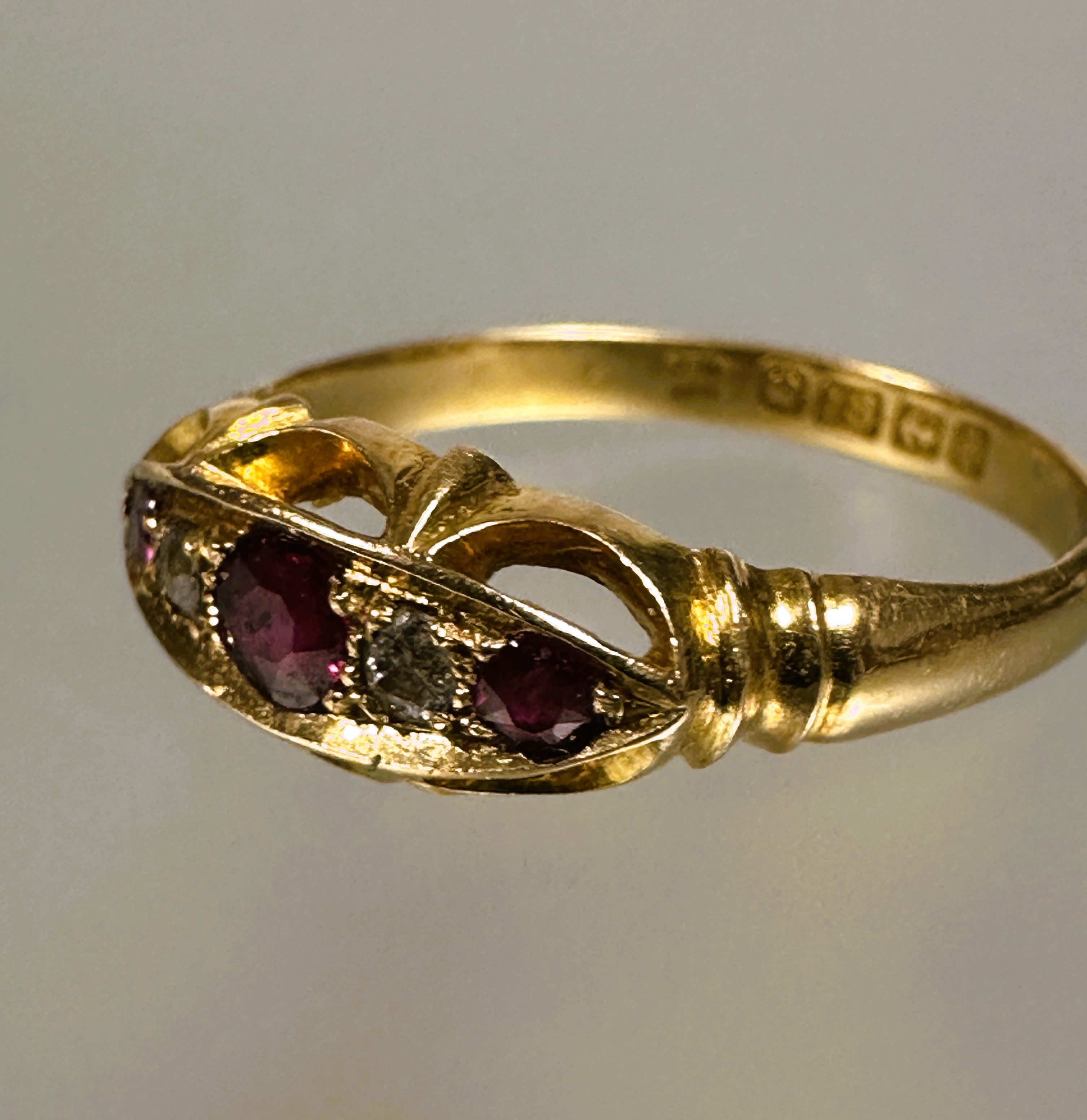 A 18ct gold three stony ruby ring the center cut stone 0.15ct flanked by a rose cut diamond and - Image 3 of 3