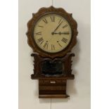 A 19th century American drop dial wall clock, the walnut case with specimen wood inlay and