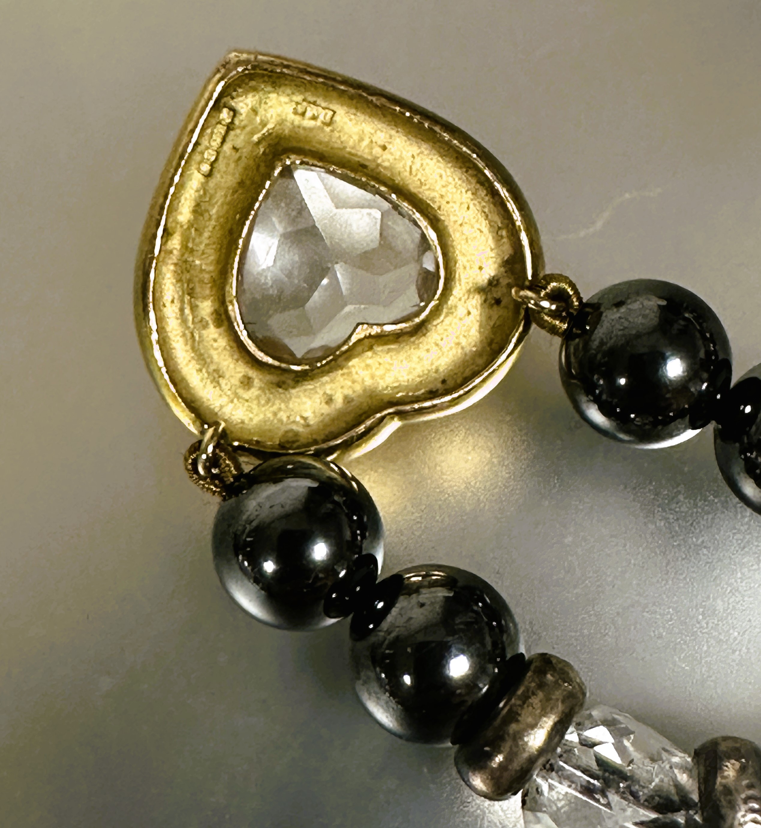 A hematite bead necklace with crystal and silver ring spacers mounted with 9ct gold heart pendant - Image 3 of 3