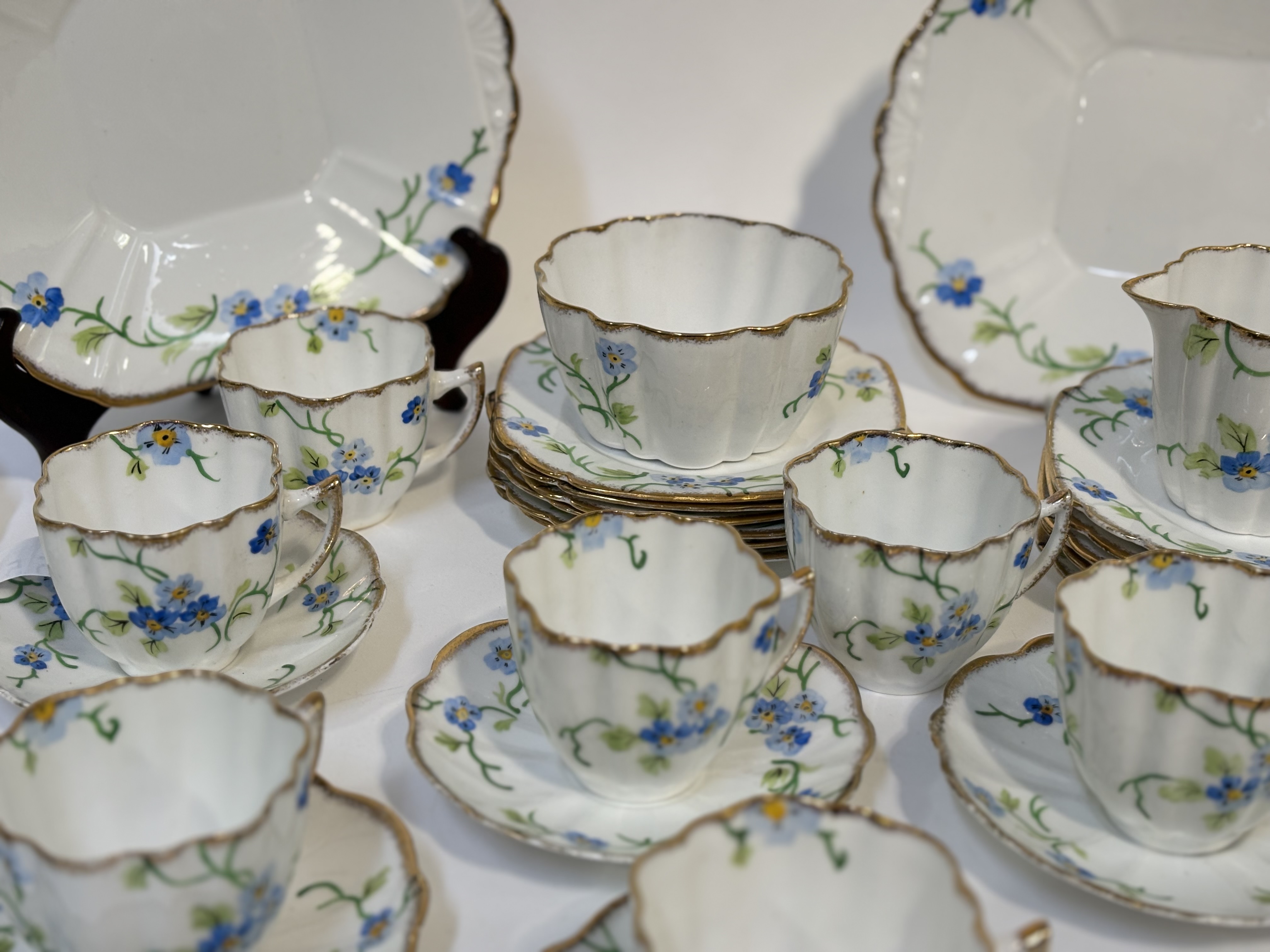 A Melba bone China part tea service  decoration with Forget-me-not's with gilt edging, comprising, a - Image 2 of 3