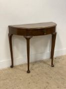 A Georgian style mahogany demi-lune console table, fitted with a single drawer and raised on
