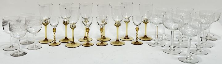 A mixed group of drinking glasses comprising eight coloured-stem wine glasses (largest h- 16cm),