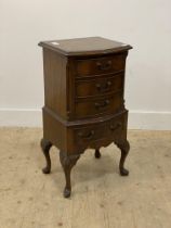 A Georgian style mahogany bow front chest, fitted with four drawers and raised on shell carved