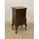 A Georgian style mahogany bow front chest, fitted with four drawers and raised on shell carved