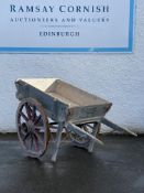 A 19th century hand drawn cart, with coopered and spoked wheels on leaf springs, and having an old