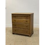 A 20th century oak chest of four long graduated drawers, raised on bun supports. H86cm, W81cm,