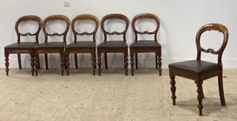 A set of six Victorian walnut dining chairs, with balloon backs, drop in seat pads and raised on